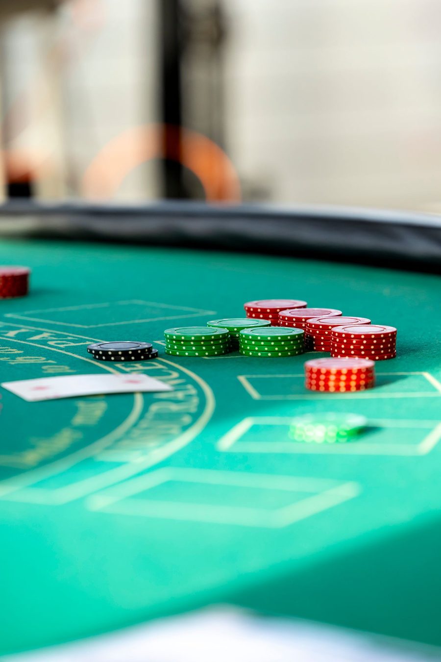 casino chips on a gaming table connected to cage management systems