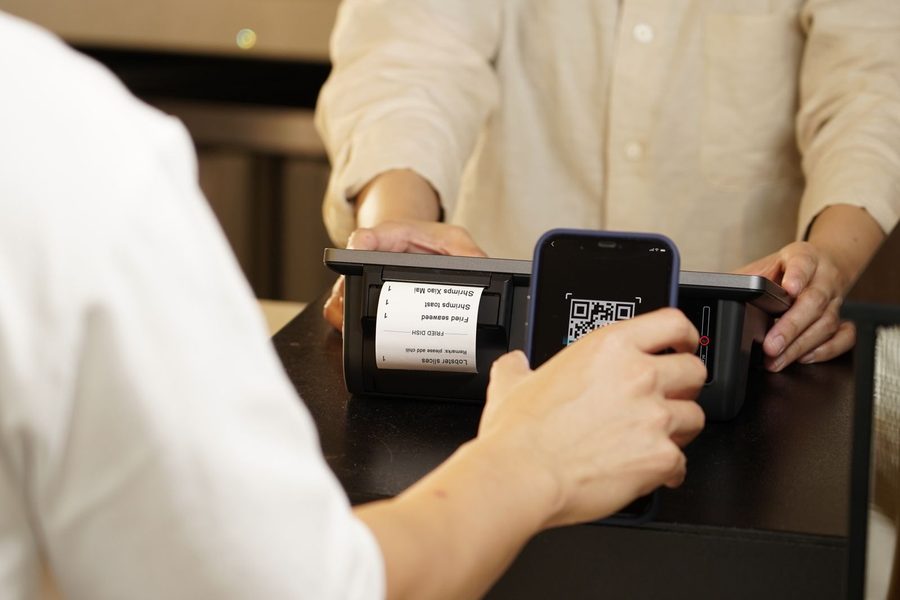 scanning a QR code to order from a restaurant menu on a smartphone